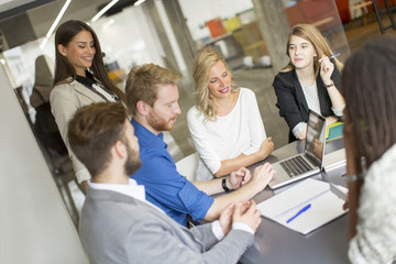 Multiracial businesspeople having meeting in conference room.