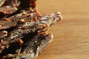 a close up macro shot of biltong (dried meat). This is a popular South African food snack. This image has selective focusing.