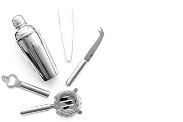 Barman equipment. Shaker, strainer on white background top view copyspace