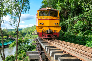 Ancient train running on wooden railway in Tham Krasae