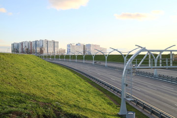 high-speed road at sunset over the sea city