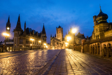 Street lamps illuminate Sint-Michielsbrug before dawn in the city of Ghent, Flanders, Belgium