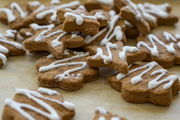 Gingerbread Christmas cookies, on a kitchen table, glazed with white glaze. Concept Christmas.