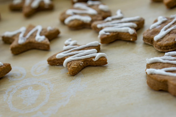 Gingerbread Christmas cookies, on a kitchen table, glazed with white glaze. Concept Christmas.
