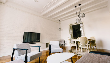 Bright spacious living room with chairs table inside