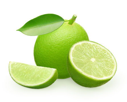Whole fresh lime fruit with green leaf, half and slice