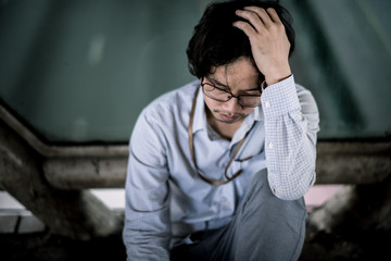 business man is stressed from his work. depression and anxiety concept.