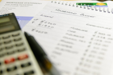 Obraz premium Household budget with a calculator and mortgage statement