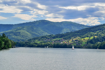 Summer mountain landscape. Beautiful river and green hills.