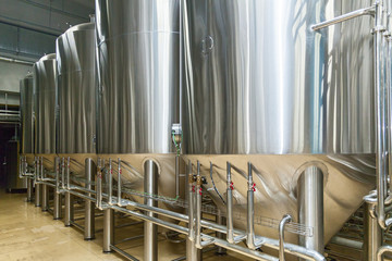 equipment for beer production, private brewery, Contemporary large steel barrels in winery, food...