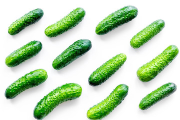 Fresh cucumbers pattern on white background top view