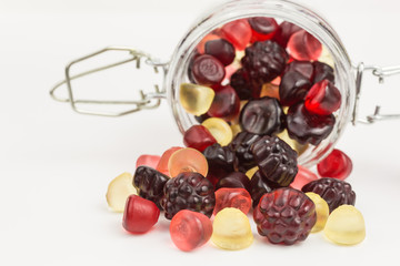 fruity gummy candies in a glass jar