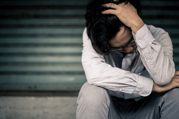 Fototapeta premium business man is stressed from his work. depression and anxiety concept.