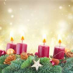 Evergreen fir tree advent garland with burning candles on golden background