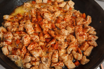 Chicken breast fried in a pan