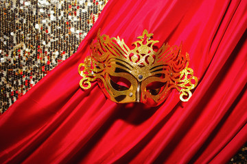 golden mask on a red cloth