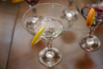 alcoholic beverage with lemon stands on the table