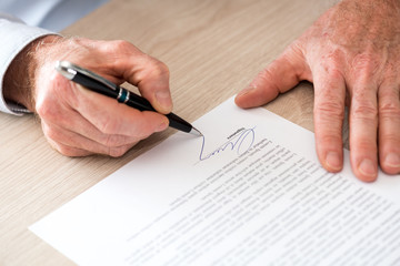 Man signing a contract