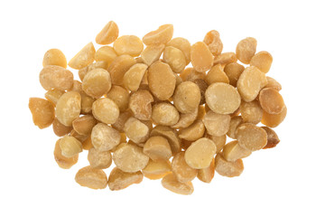 Top view of a small pile of dry roasted and salted macadamia nuts isolated on a white background.