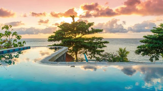 Exotic romantic sunrise infinity pool with panoramic sea views