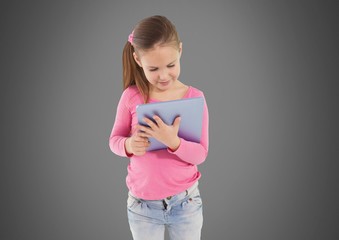 Fototapeta premium Girl against grey background with tablet