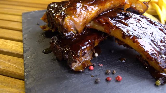 grilled bbq ribs on stone plate