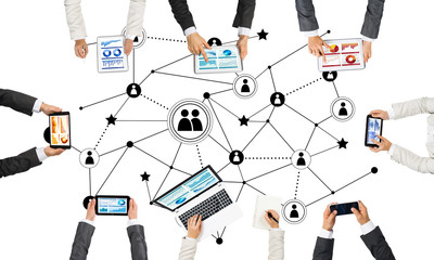 Top view of businesspeople sitting at table and using gadgets