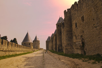 the road near the castle of carcassonne at sunset - 177816195