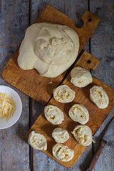 The cooking process: baking with cheese - cheese sticks (long buns)