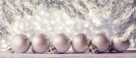 Christmas background with decorative balls over defocused lights