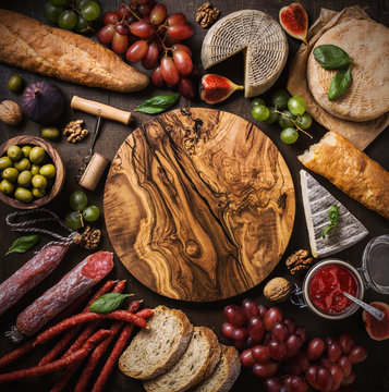 Flat lay composition with cheese, meat and fruits