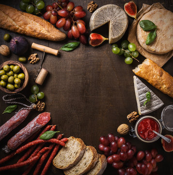 Flat lay composition with cheese, meat and fruits