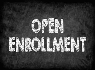 Open enrollment. Black board with texture. health care and business background.