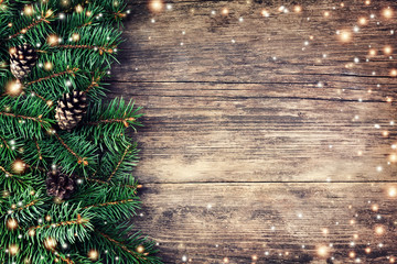 Christmas fir tree on a wooden background - Powered by Adobe
