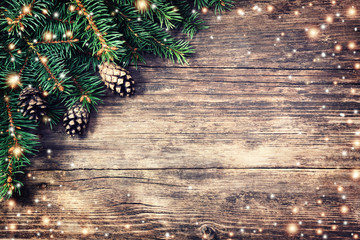 Christmas fir tree on a wooden background