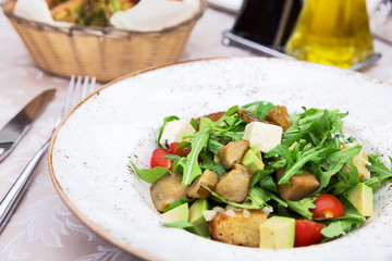 Fresh green salad with pears, feta cheese and avocado