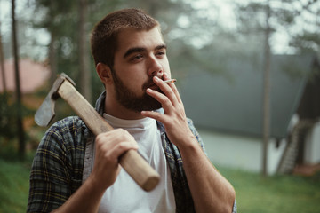Lumberjack having a rest and smoking