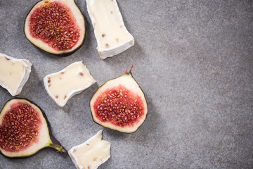 Camembert and fresh figs on stone slate