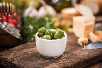 Green olives in bowl,spanish tapa bar food