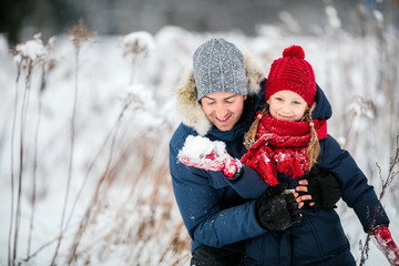 Fototapeta premium Father and daughter outdoors at winter