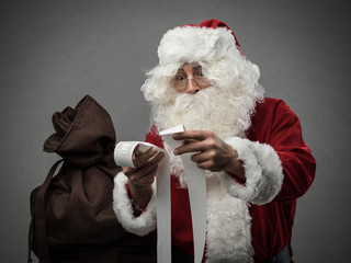 Santa Claus checking bills
