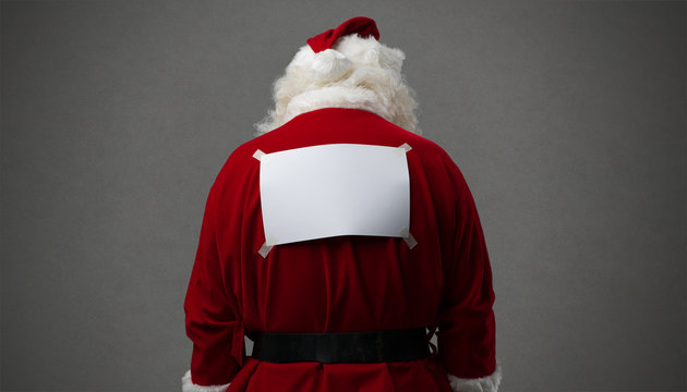 Santa Claus with a blank sign on his back