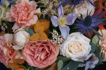 Beautiful wedding florist bouquet with roses closeup background