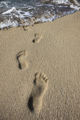 Human footprints in the sand
