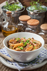 Pasta penne with pork sauce.