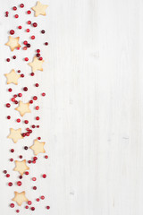 Background with traditional winter cookies and cranberries