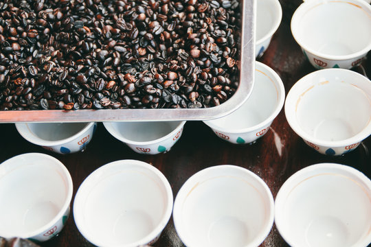 Coffee time - Tray with coffee beans and white coffee cups