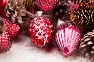 Christmas cone with red berries on a bokeh background.