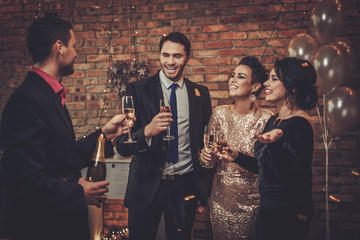 Happy beautiful couples celebrating Christmas