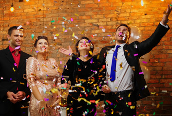 Happy beautiful couples celebrating Christmas